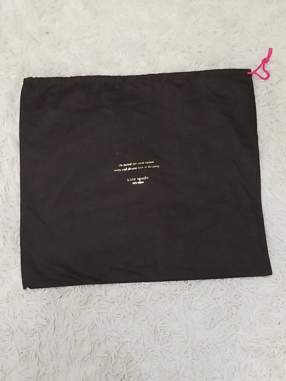 kate spade black dust bag with pink drawstring and gold logo